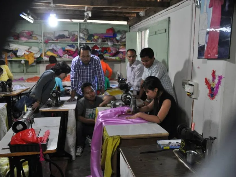 Tailors at work during the solar-powered sewing machine pilot