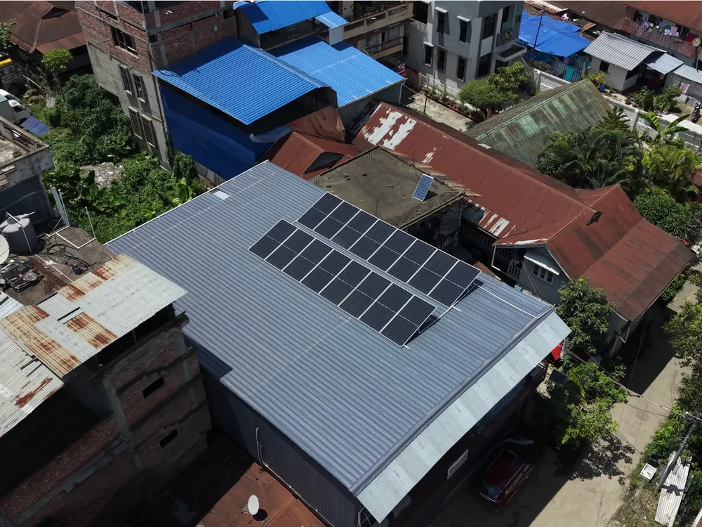 Aerial view of rooftop solar panels installed on a home in Imphal, Manipur