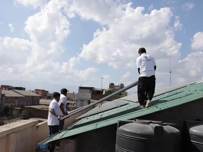 Eartheners technicians working on a rooftop installation in Imphal
