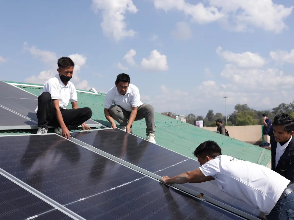 The Eartheners team installing rooftop solar panels in Manipur