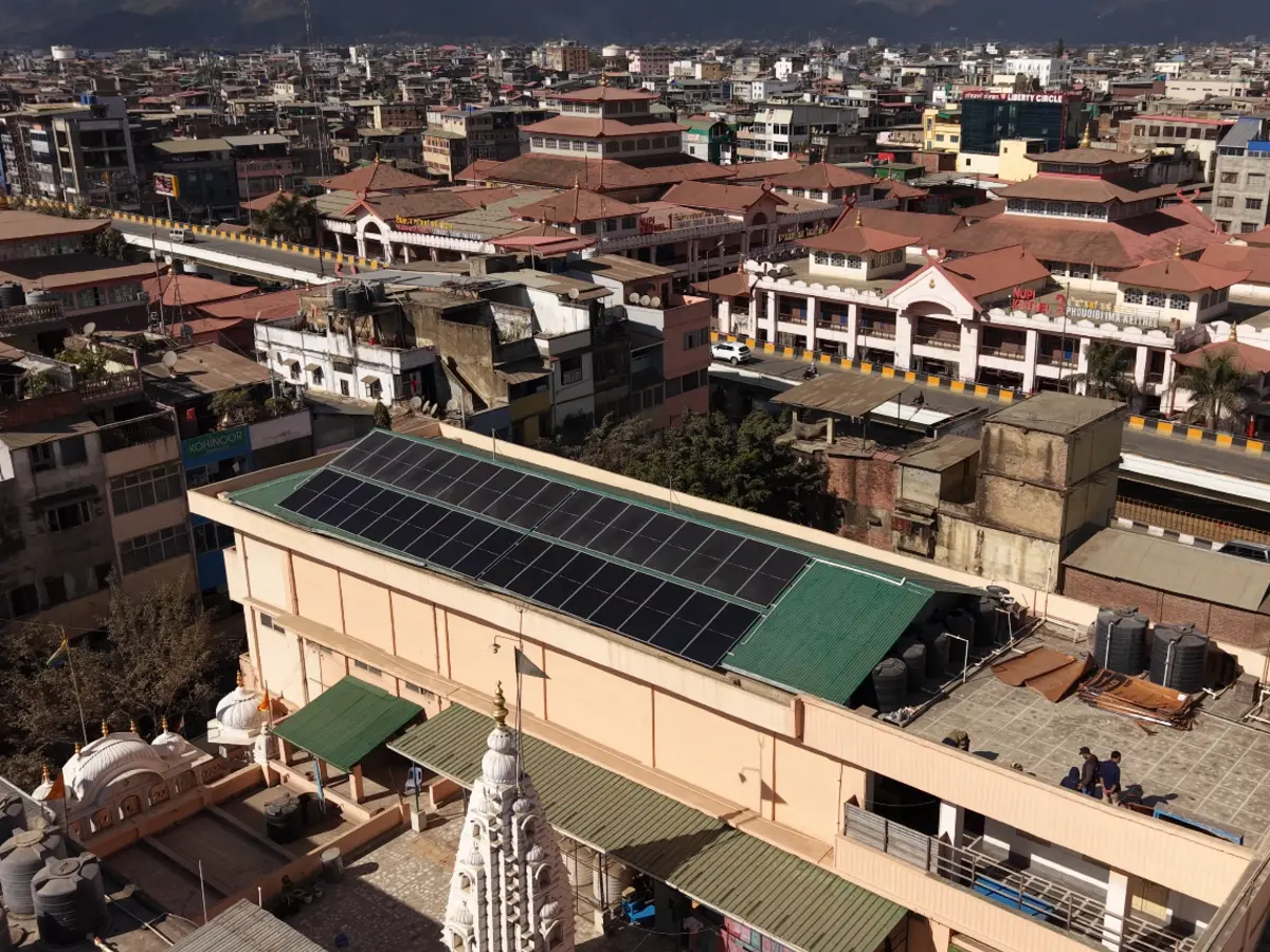 Rooftop solar panel installation in Manipur under a clear sky