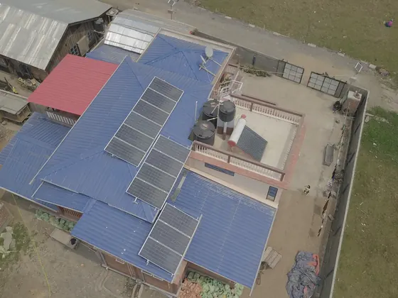Aerial view of an Eartheners rooftop solar installation in Imphal